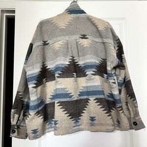 This is a beautiful warm jacket or laying piece over a dress.